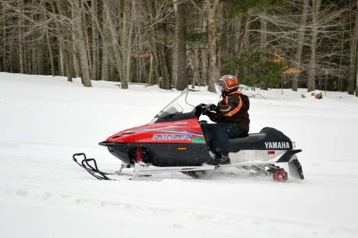 A snowmobiler enjoys the fresh snow in Kaleva this week.