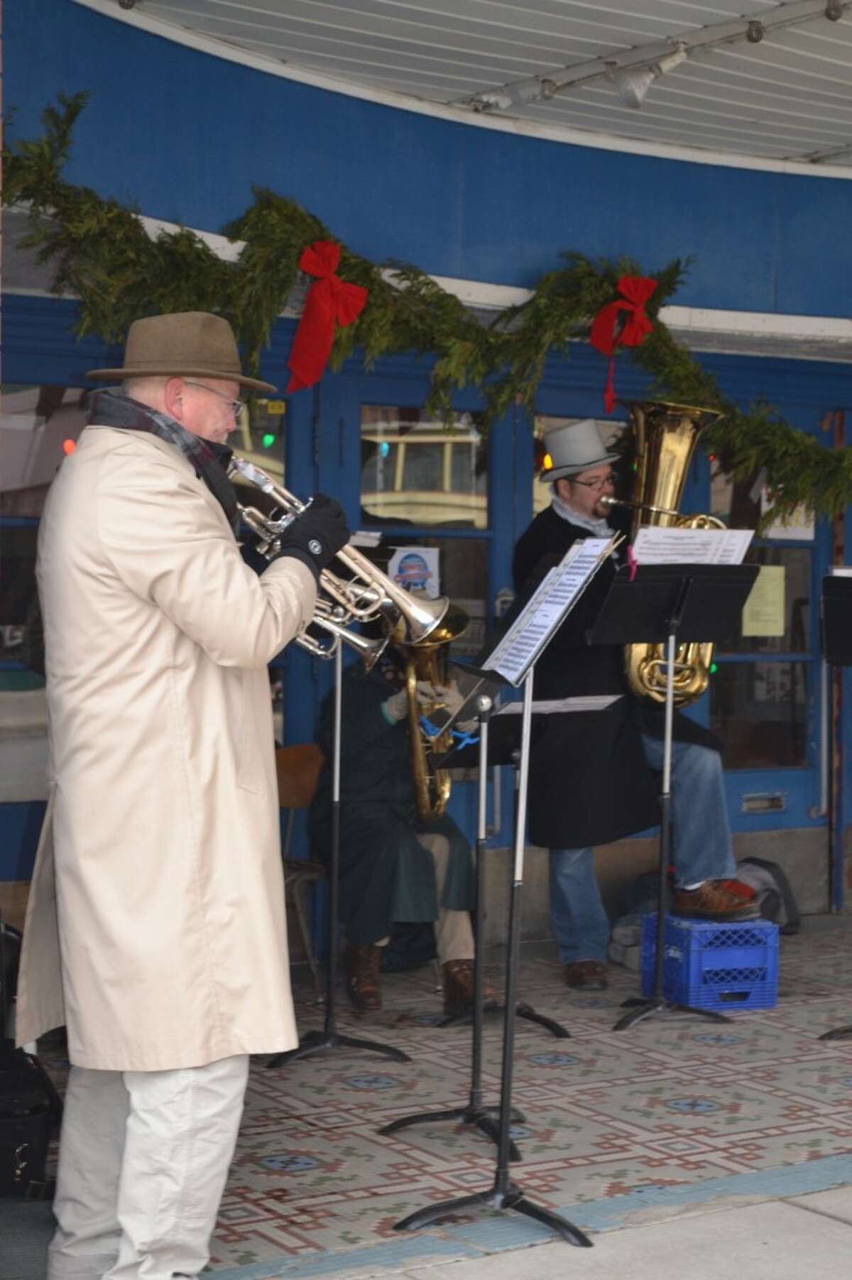 A member of the Manistee Community Band performing during their Christmas Concert on River Street. (Meg LeDuc / News Advocate)