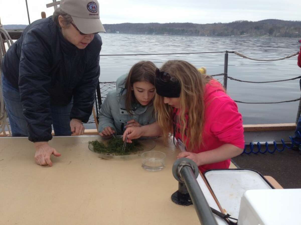 Students from Kennedy Elementary School work on experiments aboard the Inland Seas educational ships based in Traverse City and Suttons Bay.