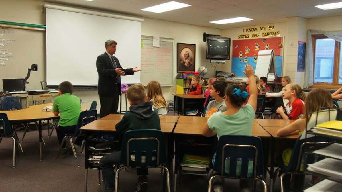 Onekama third grade students were given a lesson on how courtrooms operate by Director of Family Services Division of the 19th Circuit Court David Thompson. He also previously served as the chief assistant prosecuting attorney for Manistee County.