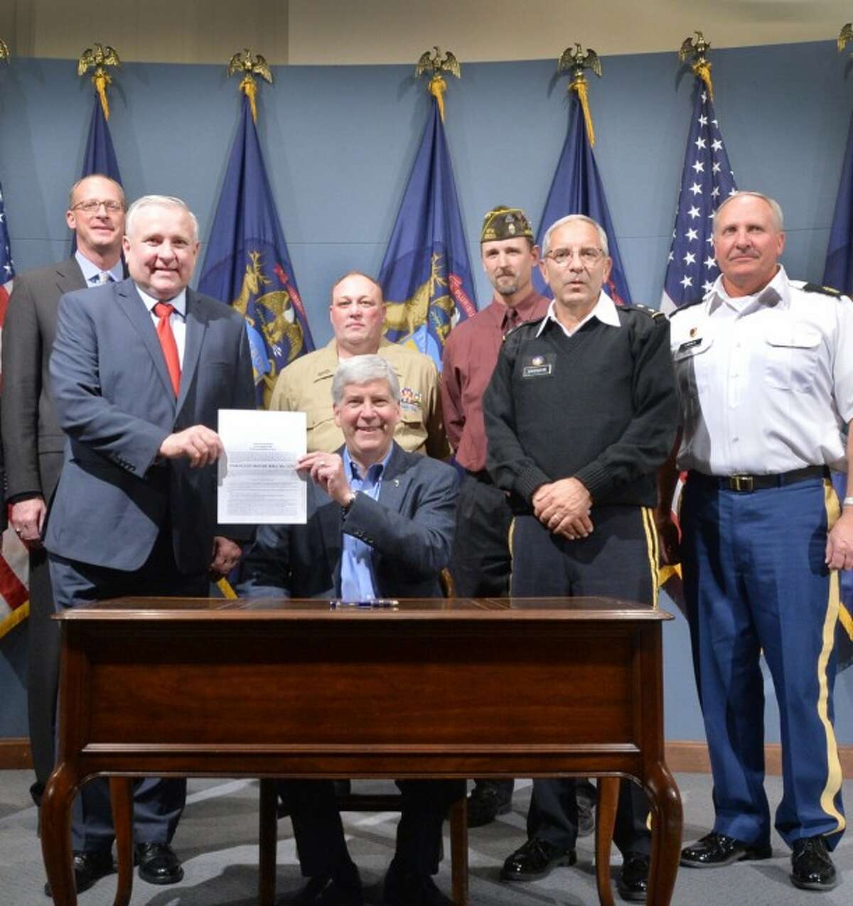 Pictured with State Rep. Ray Franz and Gov. Rick Snyder as he signs the veterans bill are from left: Steve Kozera from the Michigan Department of Military and Veterans Affairs; Manistee County veterans Tony Covell; Jeffrey Franz; Major General Gregory Vadnais; and Command Sergeant Major Dan Lincoln.