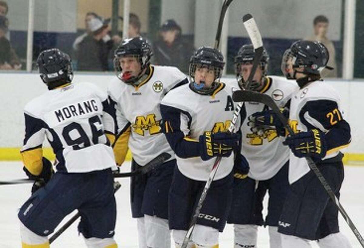 Manistee forward Jacob Harrie (11) celebrates a goal during Saturday’s loss to Grand Rapids Christian with teammates (from left to right) Chad Morang, Kienan Kowalski, Keegan Nowaczyk and Sam Johnson. The Chippewas will play two games this weekend. (Matt Wenzel/News Advocate)