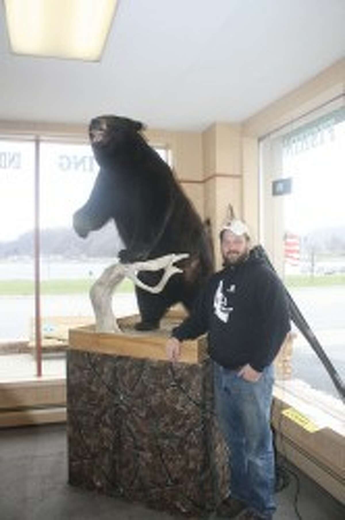 Jason Ware stands next to the 511-pound bear he shot in Ontario in 1998. (John Raffel/Pioneer News Network)