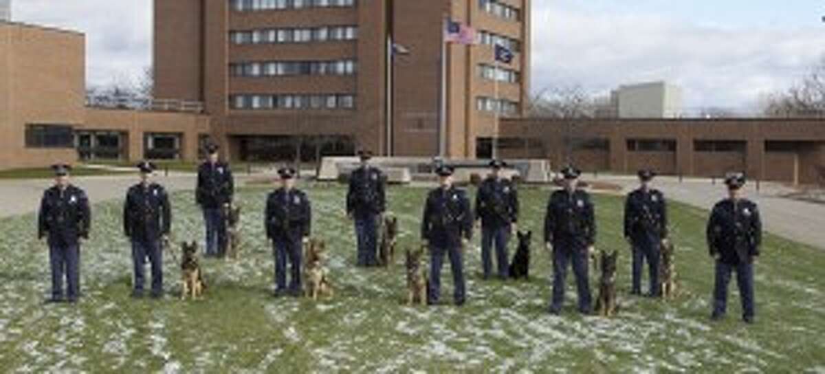 On Friday, 12 canine teams, including eight new teams and four replacement teams, graduated from the MSP 2013 Basic Canine School.