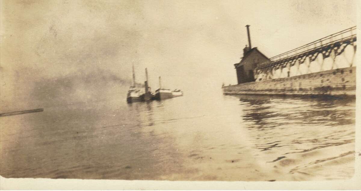 This early 1900s photo shows several ships entering the Manistee harbor. (Courtesy Photo/Dale Picardat)