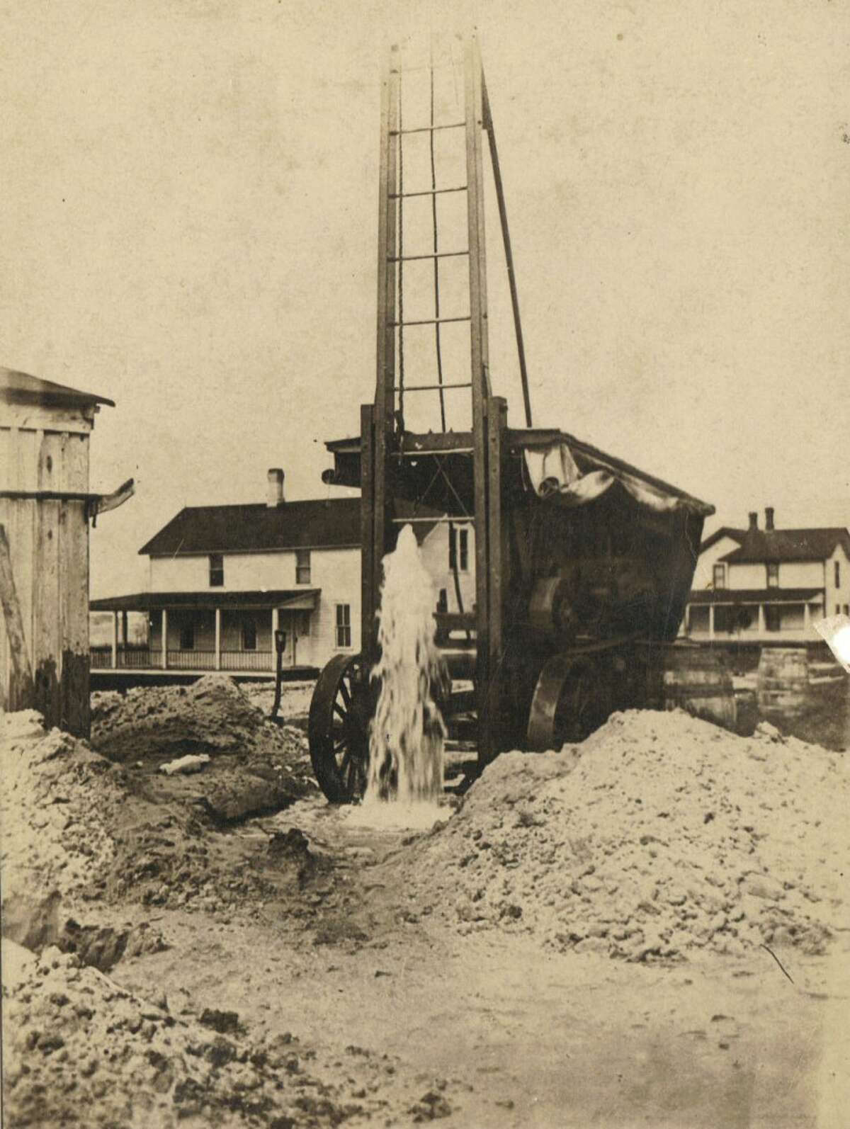 This early 1900s scene shows an artesian well that was drilled in Onekama. It was noted on the photo that the well was 126 feet deep and water flowed at a rate of 125 gallons per minute. (Courtesy Photo/Manistee County Historical Museum)