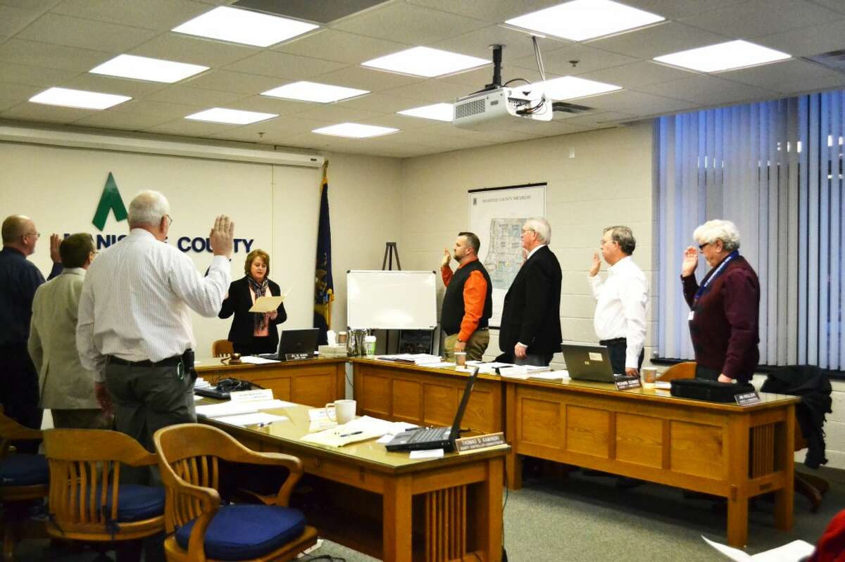 County commissioners are sworn in Wednesday morning at the annual organizational meeting. At the meeting, Jim Krolczyk and Ken Hilliard were re-elected chair and vice-chair of the county commission. (Meg LeDuc/News Advocate)