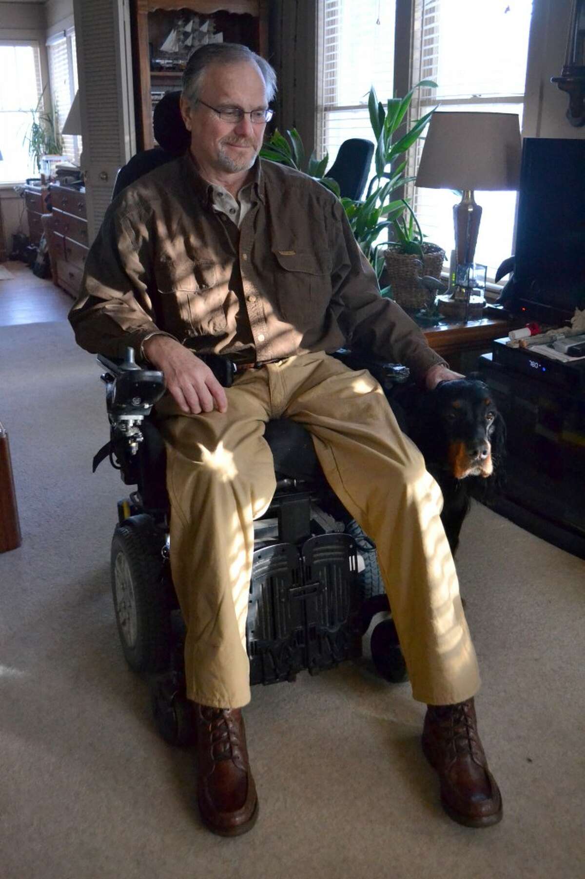 Charlie Ganss, who injured his spinal cord in a fall from a tree stand 13 years ago, is lobbying Blacker Airport to buy equipment that could load a power chair onto a plane. (Meg LeDuc/News Advocate)