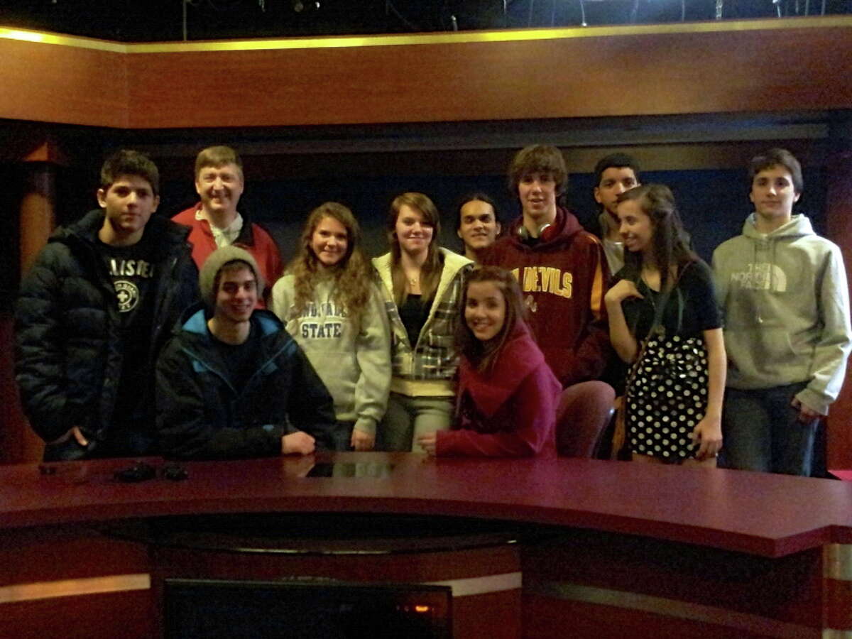 Shown are members of Brian Veine’s video production class that visited Channel 9 and 10 for a field trip to learn how televised news works. Shown left to right are Eduardo Mattos, Veine, Tim Pointer, April Williams, Natasha Zuchowski, Sarah Danks, Andre Neebnagezhick, Juan Nunez, Alberone Sales, Julie Hagadorn, Lucas Klotz. (Courtesy photo)