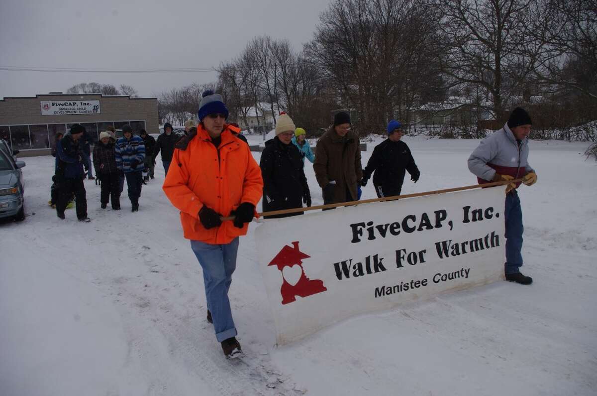 It was cold and snowy as the walkers completed the two-mile Walk for Warmth in Manistee. (Dave Yarnell/News Advocate)