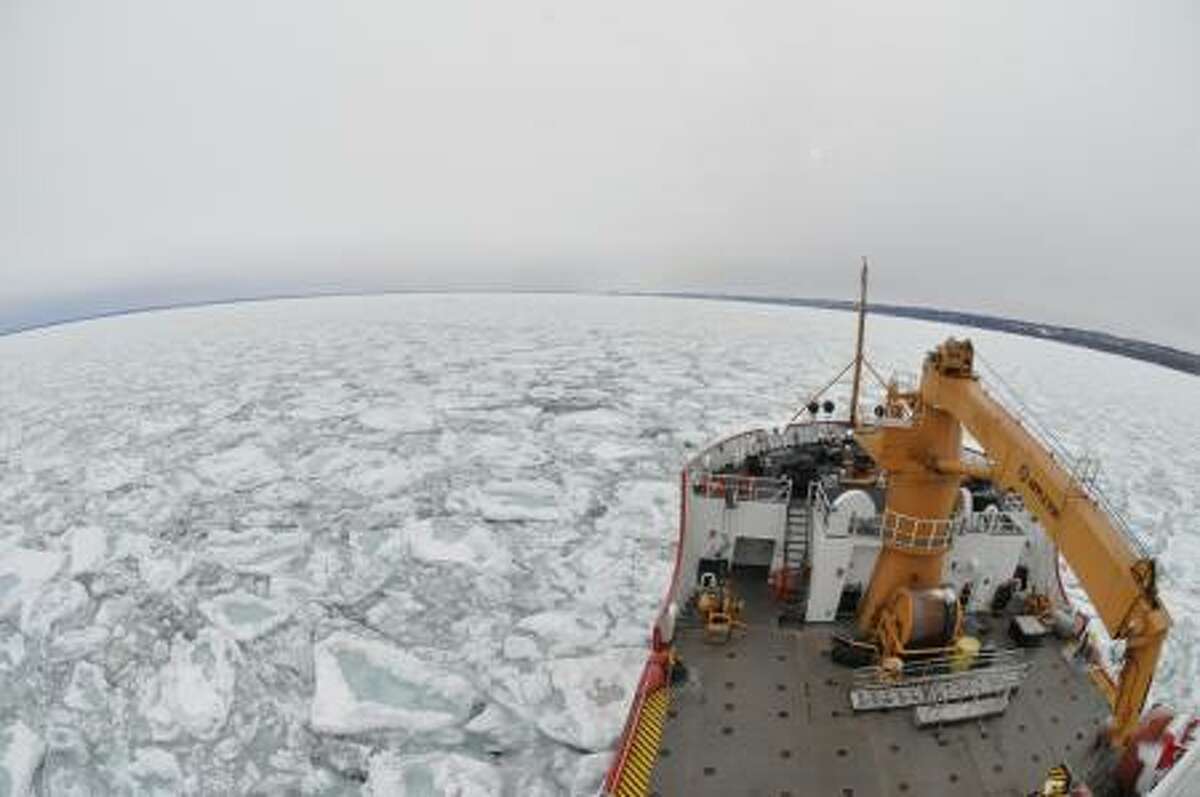The Coast Guard Cutter Mackinaw breaks through Lake Superior ice 16 to 20 inches thick about five miles off the Duluth shoreline. (Courtesy Photo/U.S. Coast Guard)