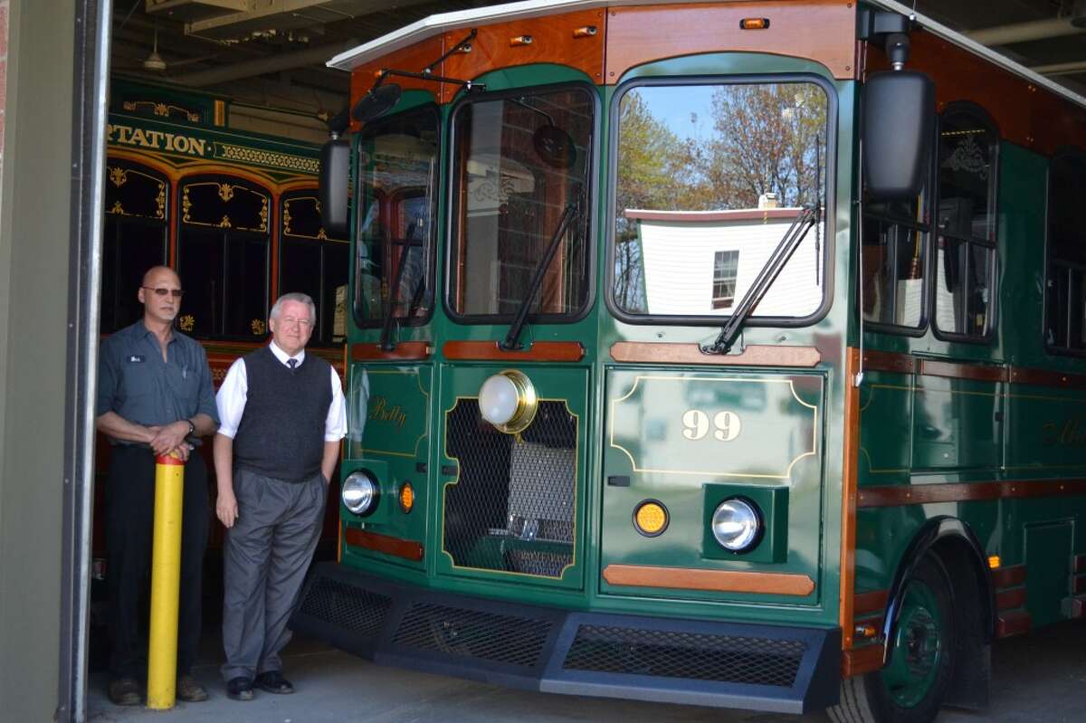 Mark Bezjian (left), Dial-A-Ride maintenance manager, and Richard Strevey, Dial-A-Ride general manager, show off the public transportation service’s newest trolley, which will be used for historical tours of Manistee during the summer. (Meg LeDuc/News Advocate)