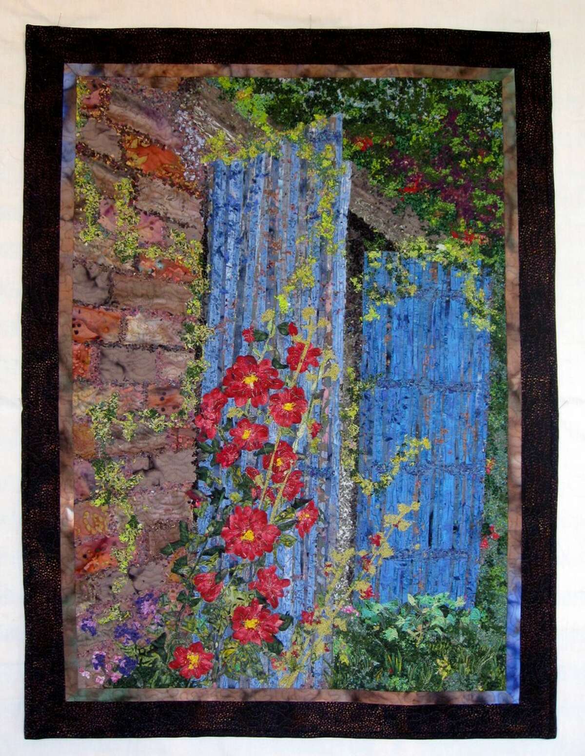 Sally Manke, of Arcadia, will display her quilt, "Hollyhock Cottage," in an international competition in Grand Rapids this week. (Courtesy photo)