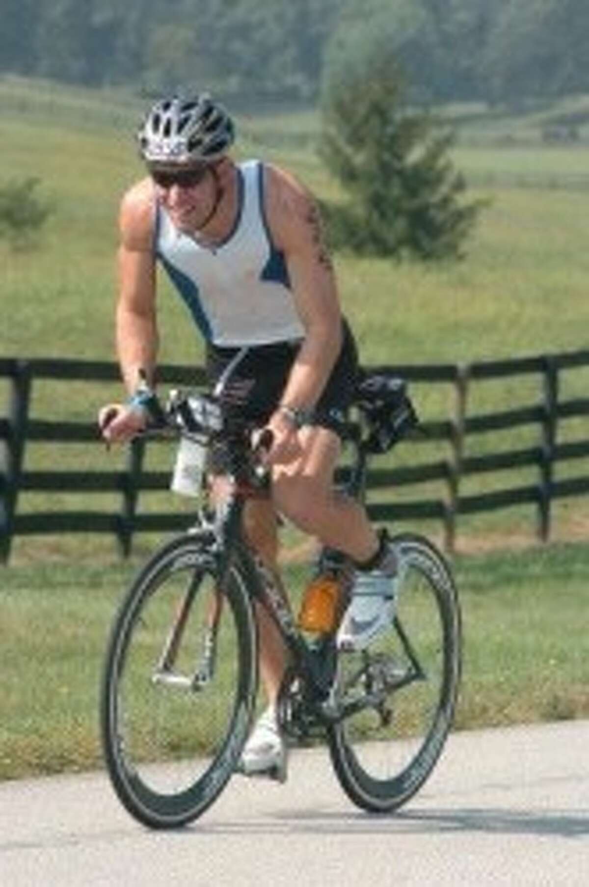 After swimming 2.4 miles, the 3,000 competitors in Ironman competition in Louisville, Ky. on Aug. 25 then bicycled 112 miles and followed that by running 26.2 miles. Manistee native Jason Dierking, seen here, competed to raise money for the Frazier Rehab Institute. (Courtesy Photo)