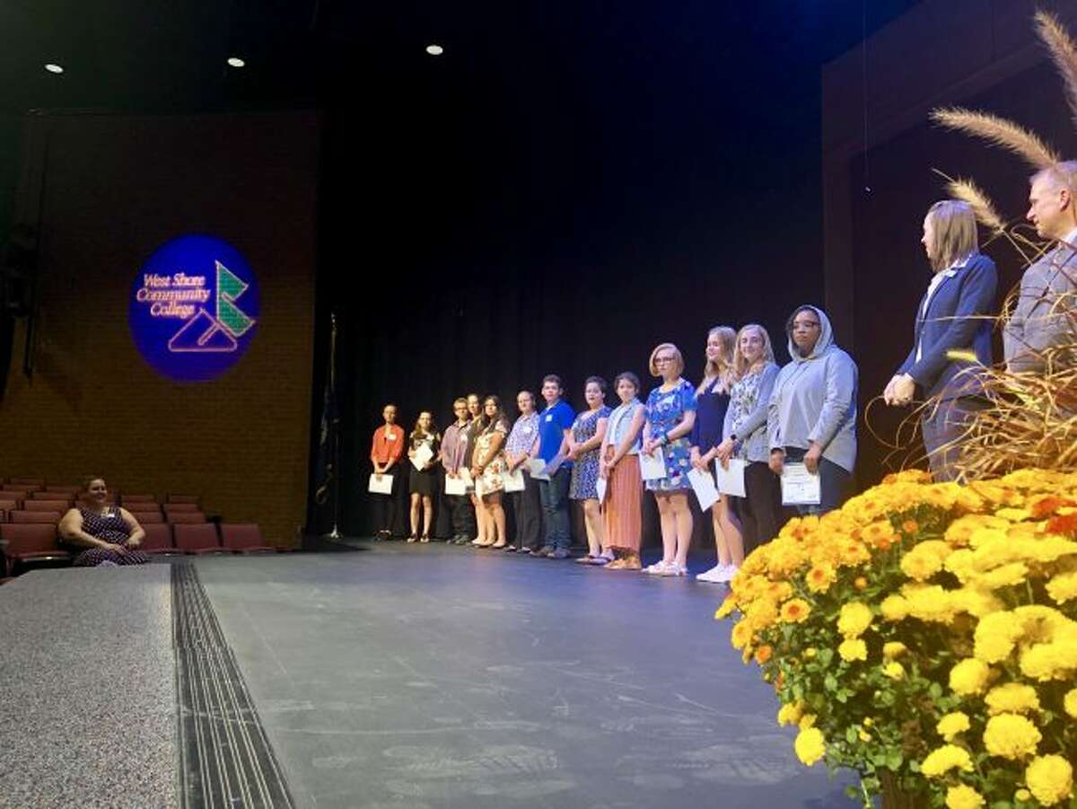Students who were inducted into the Manistee County Community Foundation’s Manistee Commitment Scholarship Program on Tuesday at West Shore Community College's Center Stage Theater. Students are shown proudly standing on the stage with their certificates.