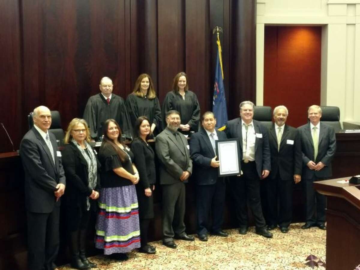 Members of the Michigan Tribal State Federal Judicial Forum and Michigan Supreme Court recently honored Peacemaker Patrick Wilson. (Courtesy Photo)