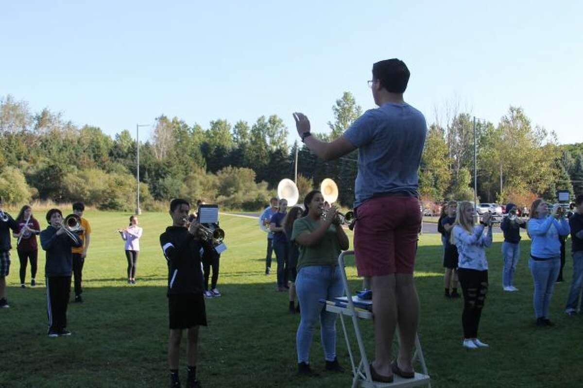 Student director Ryan Biller leads the Manistee High School Marching Band in a practice session for the Cadillac Marching Band Exhibition that will take place on Monday. The Chippewa band will perform at 6:50 p.m. at Veterans Memorial Stadium in Cadillac.