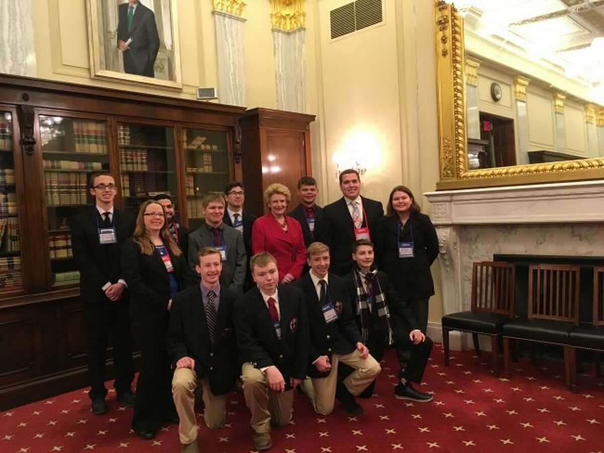 Students pose with Michigan Sen. Debbie Stabenow after visiting with her at her office in Washington D.C.