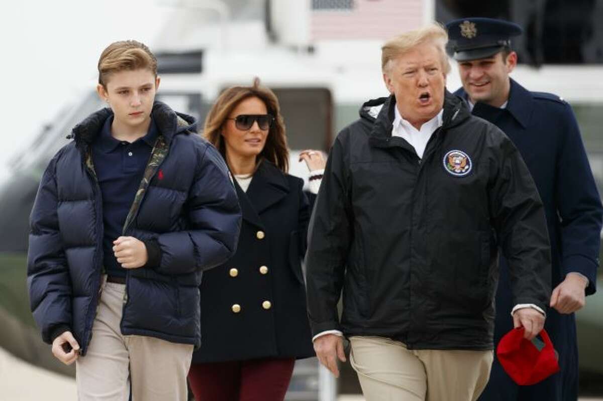President Donald Trump, first lady Melania Trump and their son Barron Trump walk from Marine One to board Air Force One on March 8 in Andrews Air Force Base, Md. The White House has a teenager as a resident once again. President Donald Trump’s youngest child, Barron, turned 13 on Wednesday. (AP Photo/Carolyn Kaster)