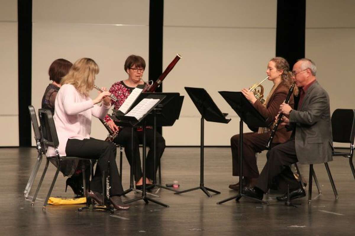 The sounds of classical music filled the Manistee Middle/High School auditorium on Monday morning when a group of faculty musicians put on a performance for MAPS band students.