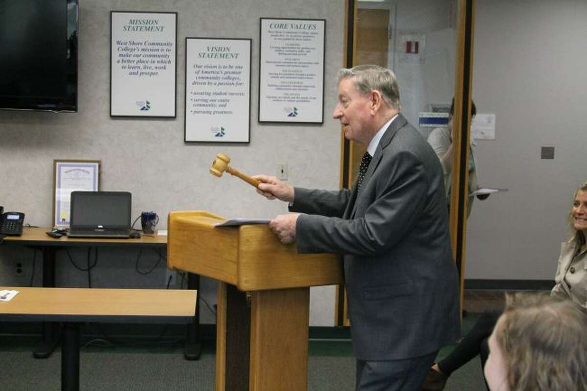 Dr. John Eaton who was the first president of West Shore College back calls Monday's board of trustees meeting to order by banging the original gavel that was used at the first board of trustees meeting on March 27,1967. When Eaton retired years later, the gavel was presented to him by the board of trustees.