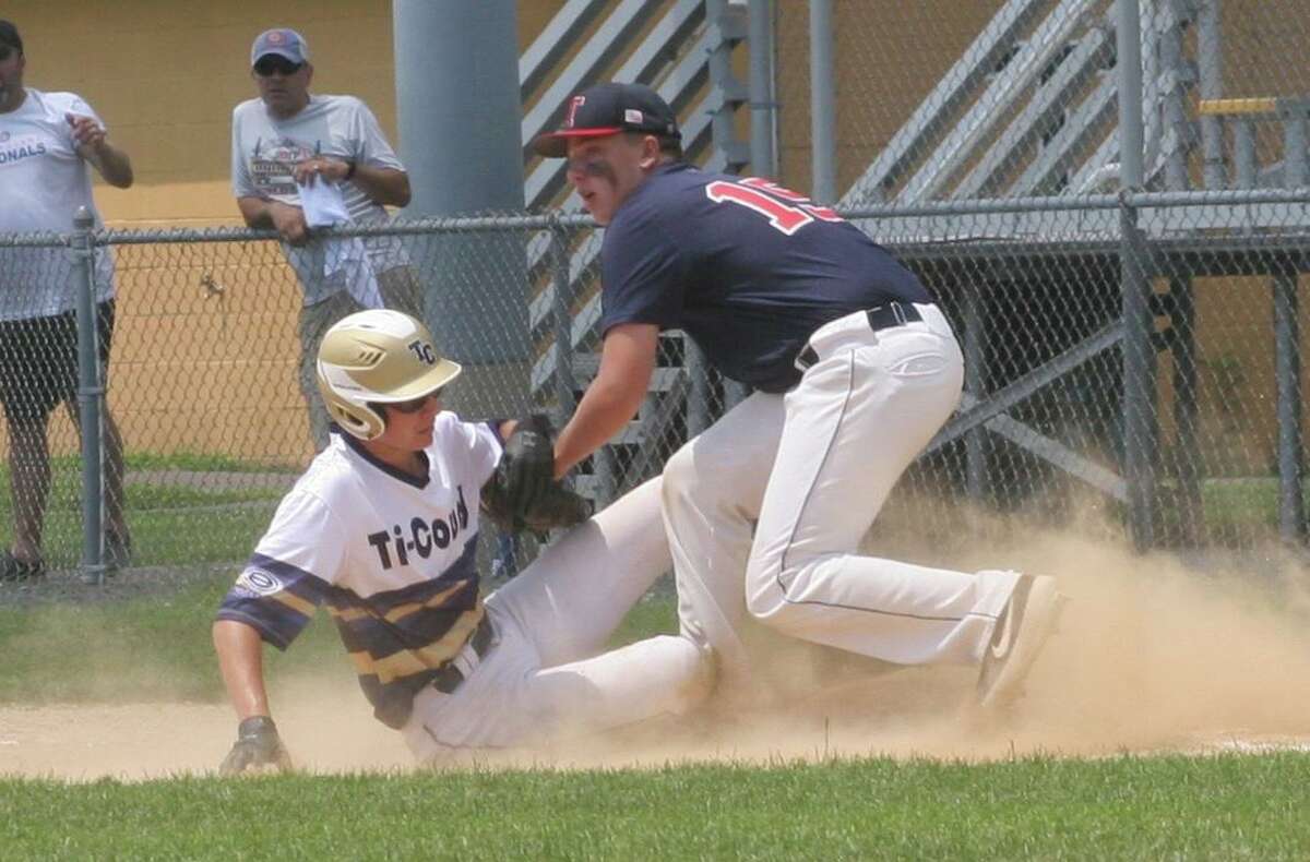 Post 141's Christian Van Zyl tags out Tri-County's Josh Wagner in the second inning of Trumbull's first-game win.