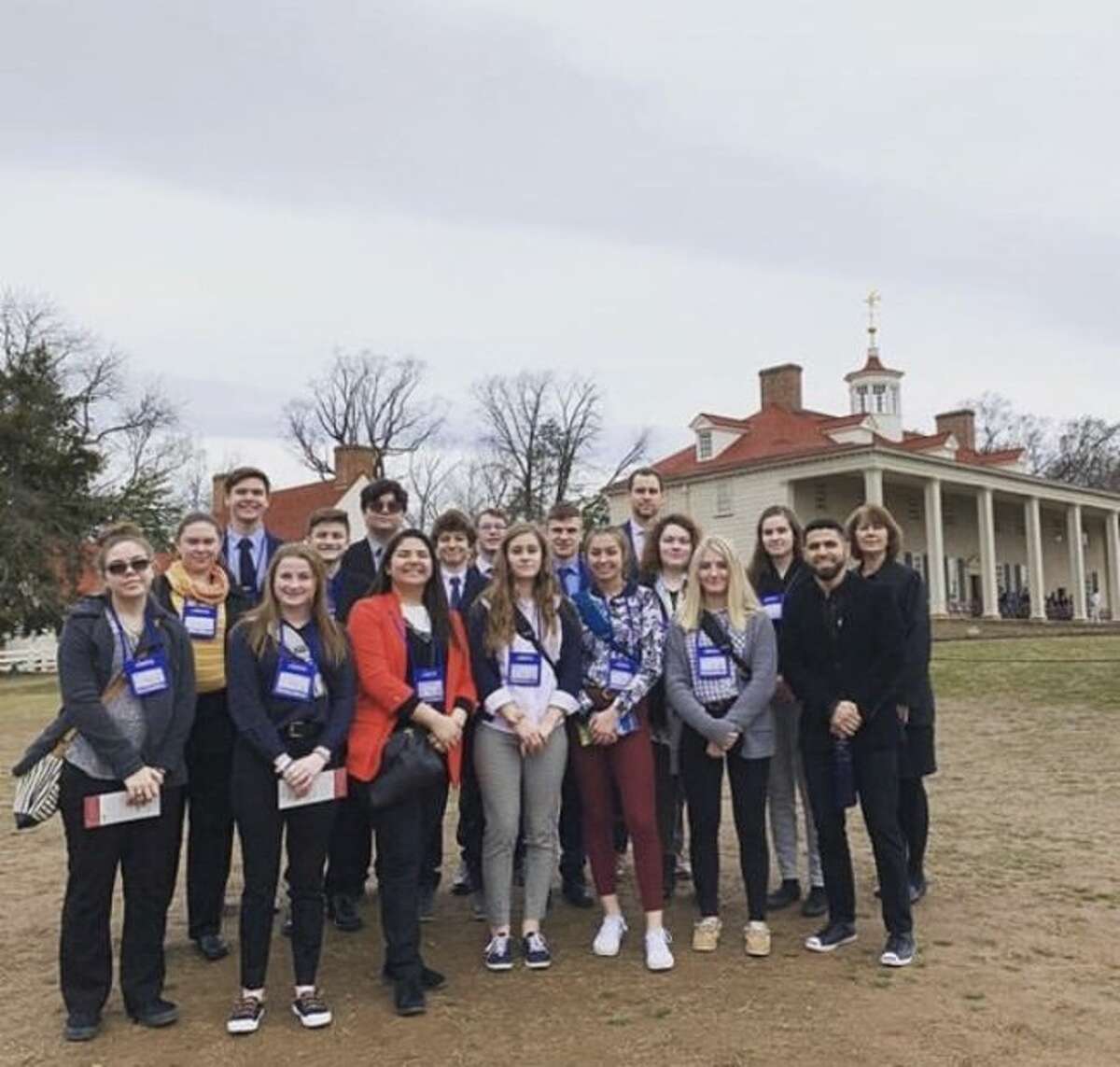 Manistee Catholic Central students pose proudly in front of George Washington's Mt. Vernon estate.