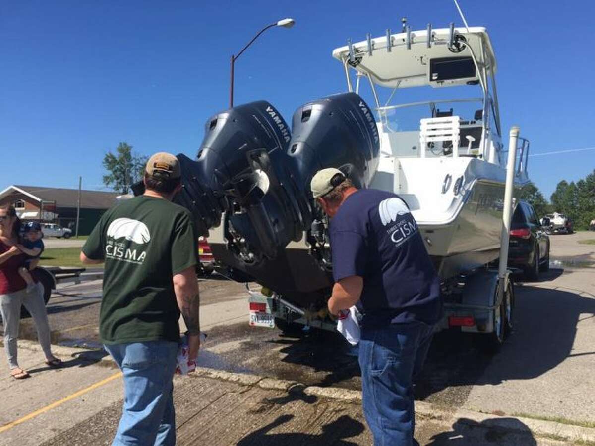 It just takes a few minutes to look for and remove debris and plants from a boat and trailer. Be sure to pull the plug, too. (Courtesy photo)