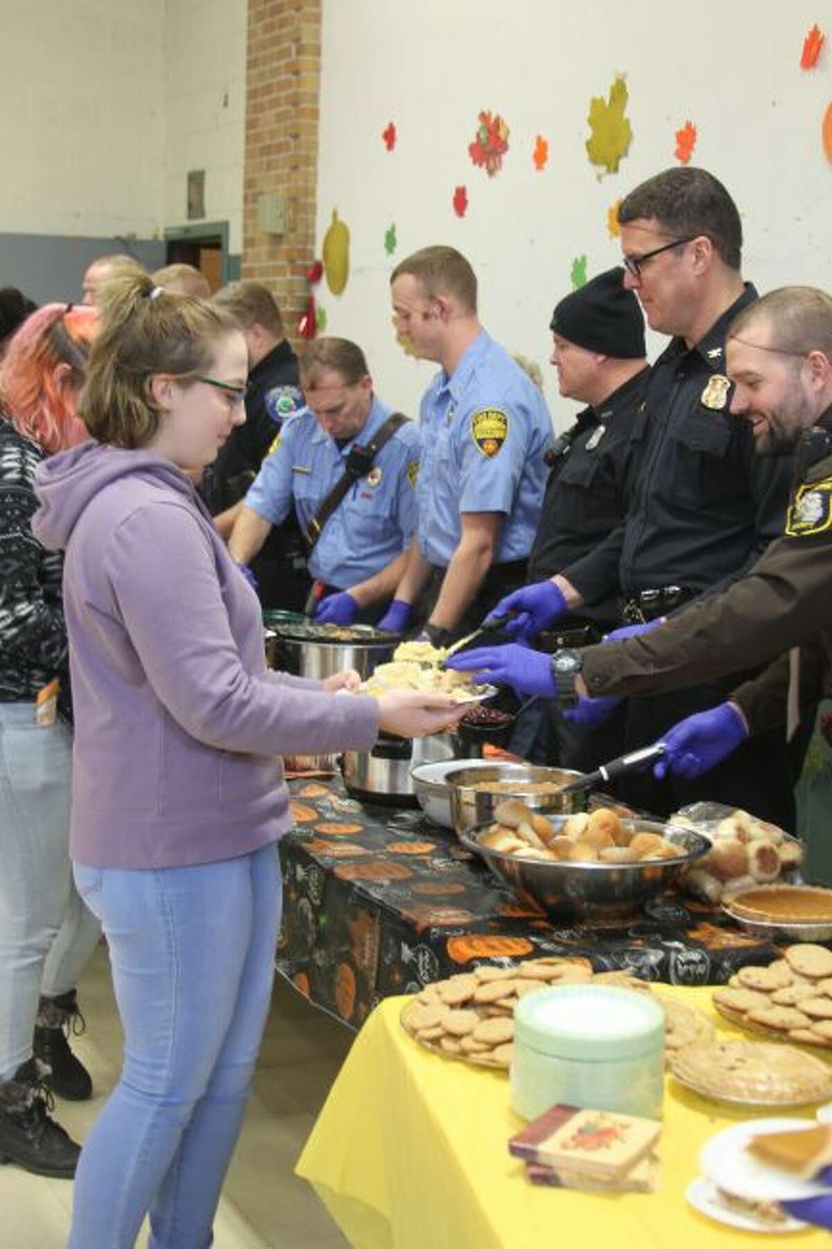 CASMAN Academy students celebrated their annual Thanksgiving Feast dinner on Tuesday at the school. Local members of law enforcement and fire departments worked as servers on the dinner that was prepared by staff and volunteers.