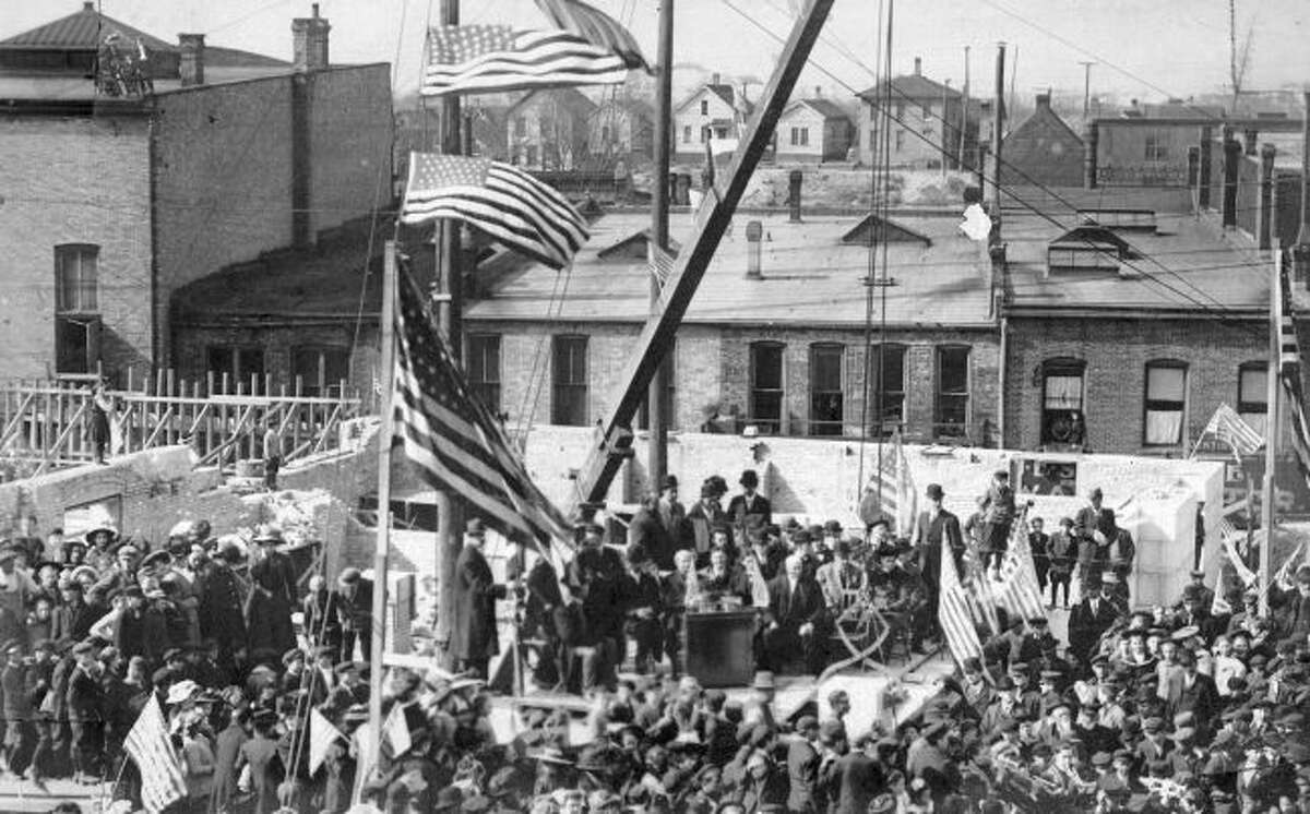 A large crowd turned out for the ground breaking ceremony for the new post office in Manistee on Maple in this early 1900 photograph. The building is still used today as city hall.