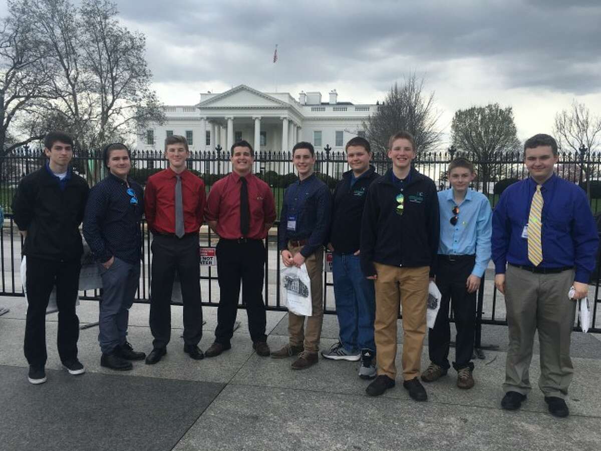 The White House rises over the shoulders of the Manistee Catholic Central students. The trip helped all the students grow as a person.