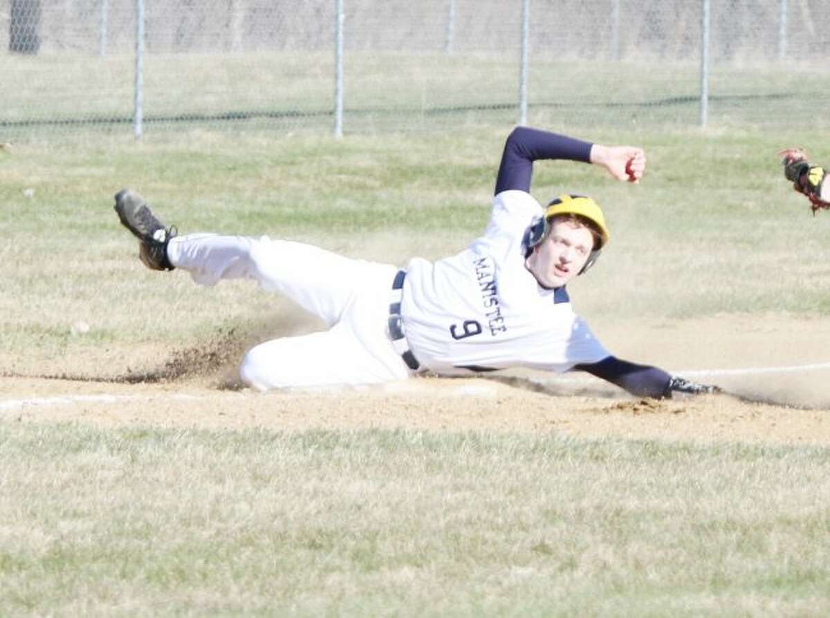 Manistee’s Andrew Jackoviak slides safely into third while stealing the base Friday against Orchard View. (Kyle Kotecki/News Advocate)
