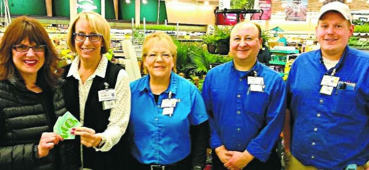 Pictured: Bonnie Kruse (left) accepts a donation from the Meijer Team; Susan Espvik, Rhea Ostrowski, Jamey Garcia and Seth Farnsworth. Ken Babcock, store director, is not pictured. (Courtesy Photo)