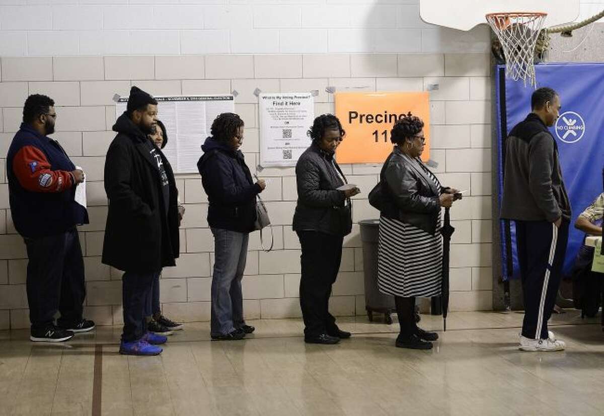 Voters wait in line on election day, Nov. 6, 2018, in Southfield, Mich. A three-judge panel has ruled that Michigan's congressional and legislative maps are unconstitutionally gerrymandered, ordering the state Legislature to redraw at least 34 districts for the 2020 election. The decision issued Thursday also requires special state Senate elections to be held in 2020, instead of 2022 as scheduled. The judges say the maps drawn by Republicans in 2011 violate Democratic voters' constitutional rights.(Clarence Tabb, Jr /Detroit News via AP, File)