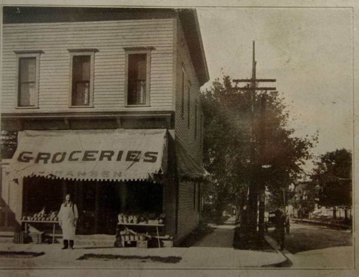 The building presently owned by Veach and Allen Optometry on First Street is shown in this photograph from the 1920s when it was Hansen's Grocery Store.