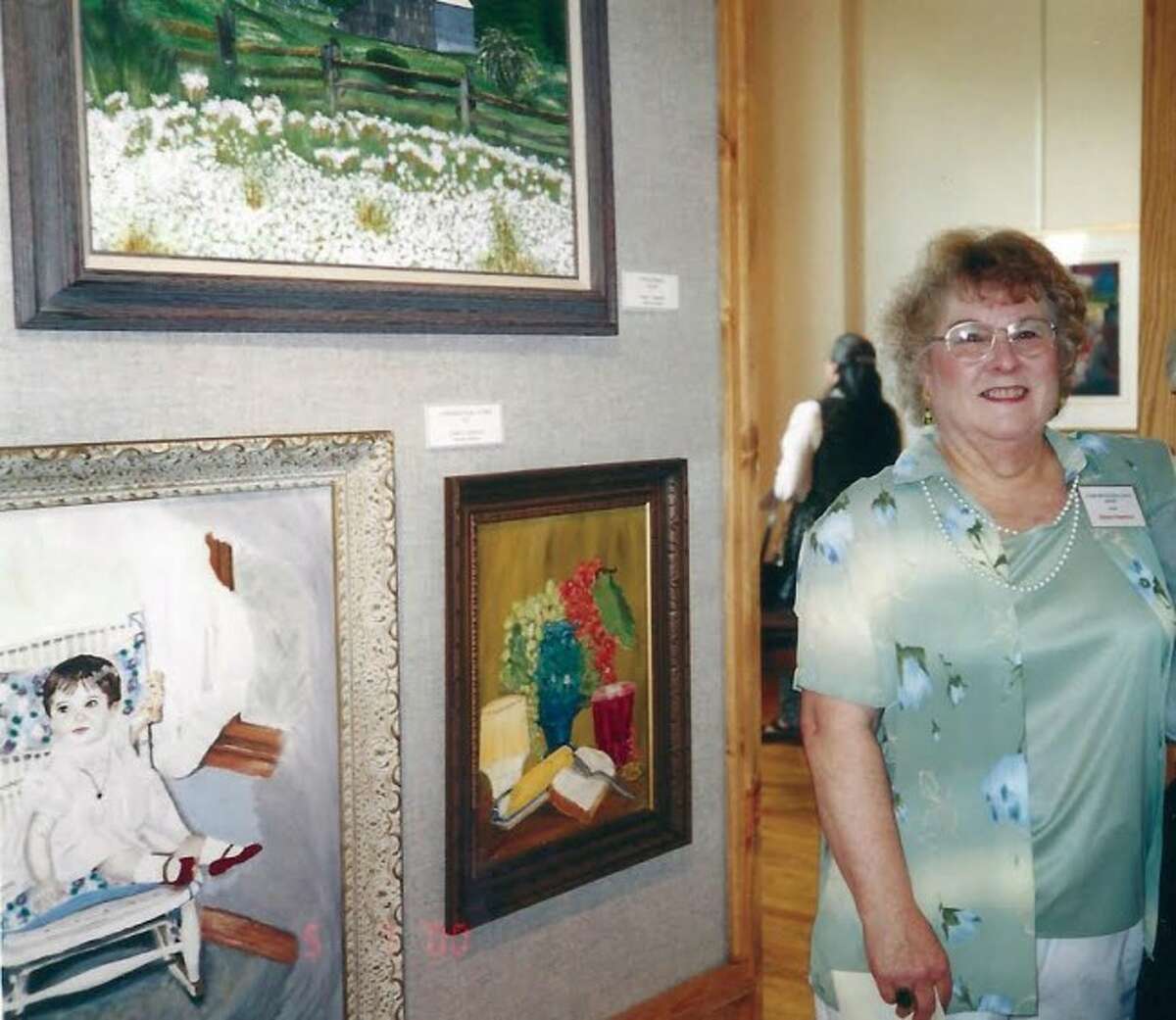 West Shore Medical Center is pleased to host an eclectic exhibit of art by Manistee native Eileen Hawkins, now through May. Pictured are Eileen Hawkins at a recent art exhibit.