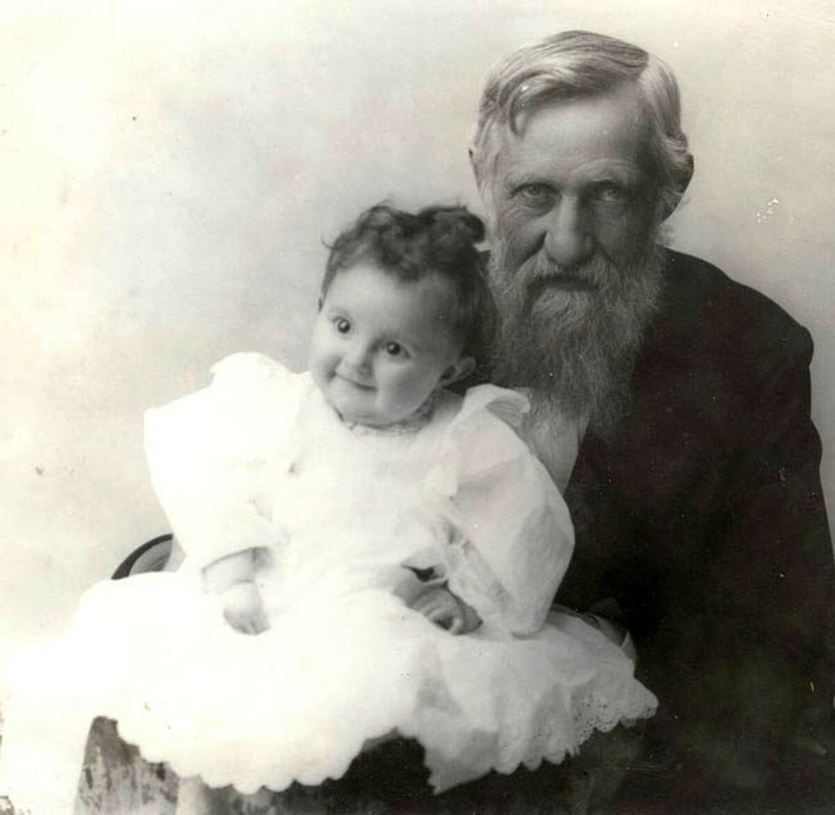 Thomas Jefferson Ramsdell sits with his granddaughter circa 1896. A pioneer Manistee resident, Ramsdell passed away on April 22, 1917.