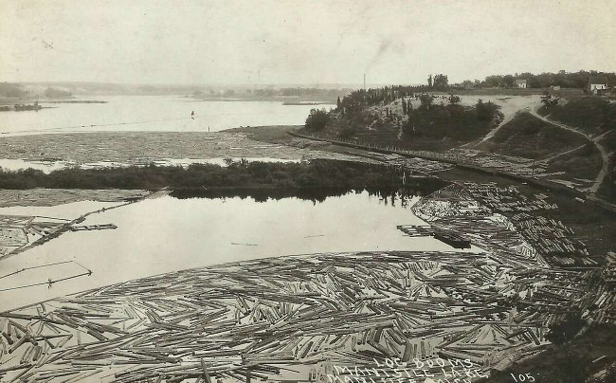 A familiar view during the logging era was Manistee Lake filled with logs that had been sent down the river to the sawmills.