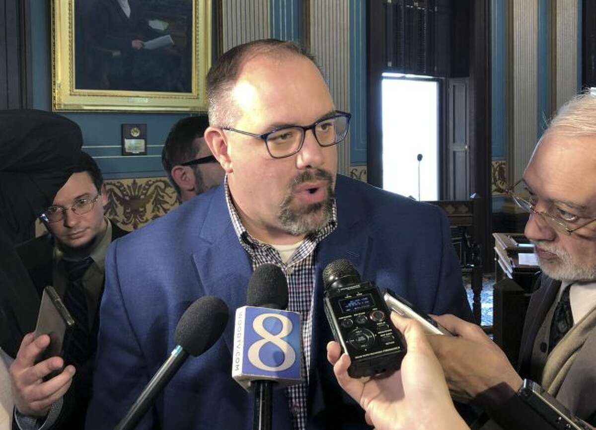 Senate Minority Leader Jim Ananich, D-Flint, speaks with reporters about snow-day forgiveness legislation that was approved by the Senate on Thursday, May 2, 2019, at the Capitol in Lansing, Mich. Democrats agreed to help give the bill immediate effect despite their concerns about a stripped provision that would have ensured some hourly school workers were paid for days when classes were canceled. (AP Photo/David Eggert)