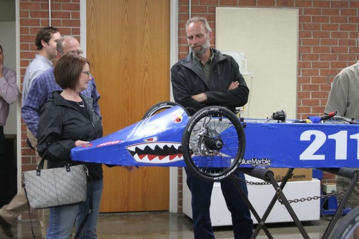 MAPS board members view an electric car that was created by West Shore ESD mechatronics students.