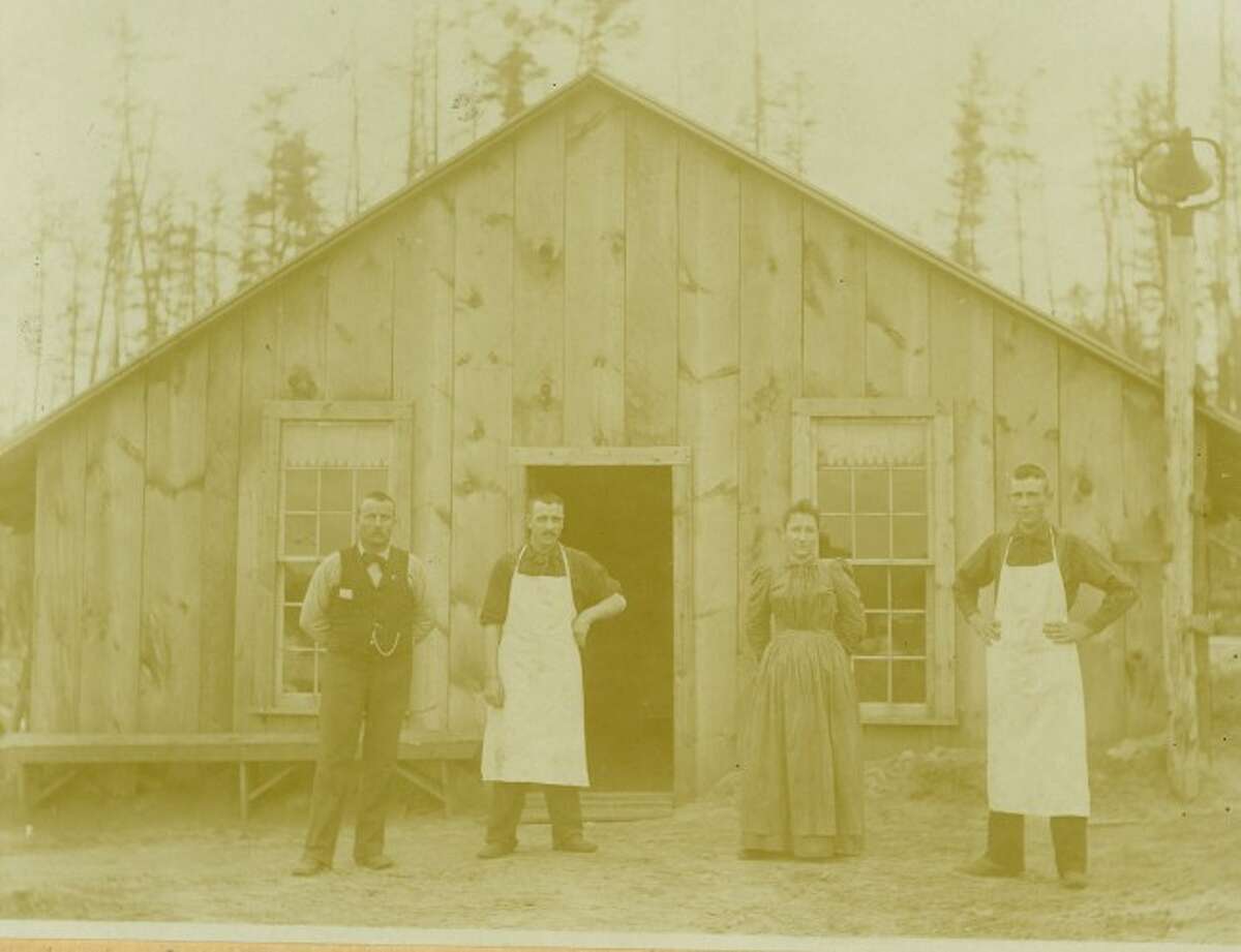 This lumberjack cook crew takes a few moments to pose for a moments in this 1905 photograph.