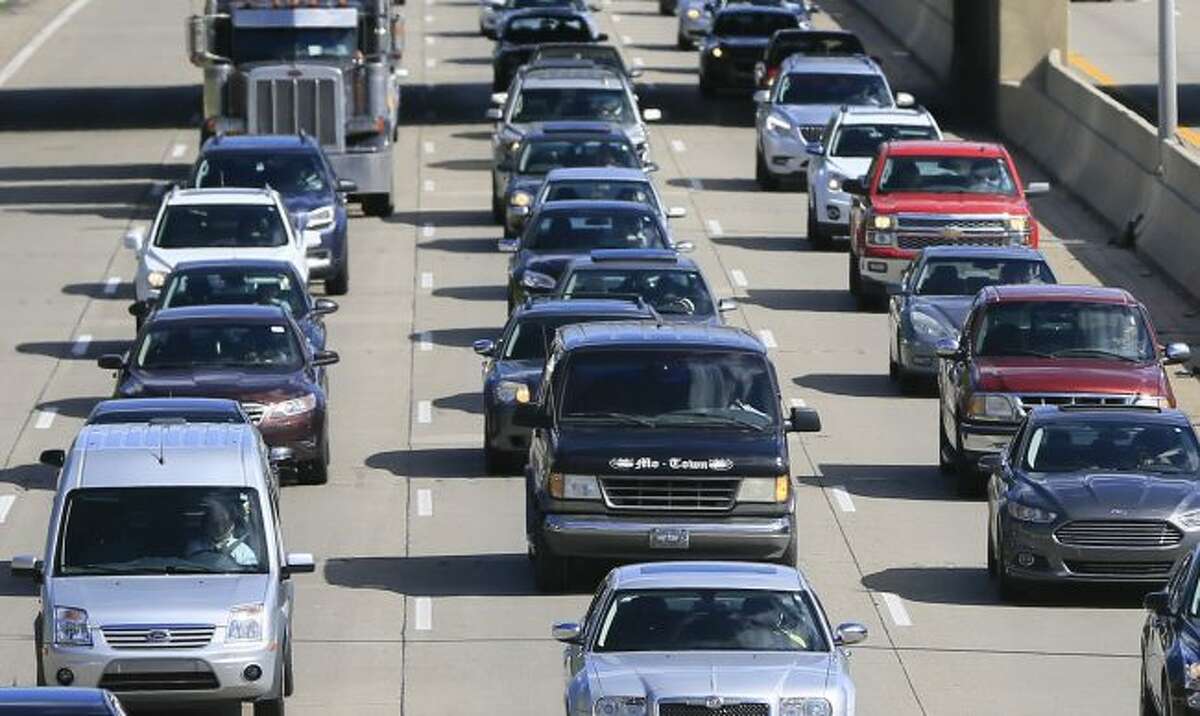 FILE- In a June 23, 2015, file photo, traffic heads north along the Lodge freeway in Detroit. Michigan, the state with the highest car insurance premiums in the country, is on the verge of a political showdown over long-running efforts to cut rates by reining in generous medical benefits. The Republican-led Legislature is pushing to save people money by making mandatory unlimited medical coverage optional, but Democratic Gov. Gretchen Whitmer opposes dueling bills that have cleared the House and Seante. (AP Photo/Carlos Osorio, File)