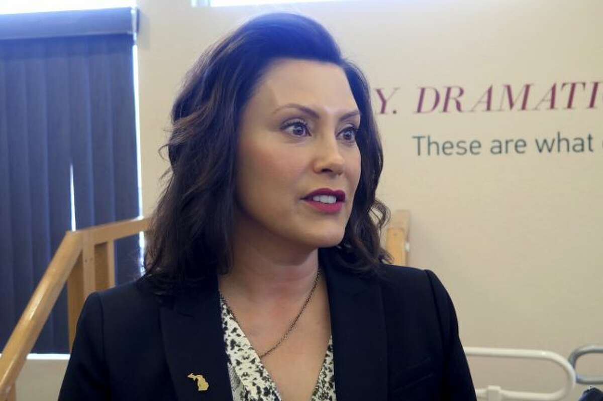 Michigan Gov. Gretchen Whitmer speaks after touring the Hope Network Neuro Rehabilitation campus Thursday, May 16, 2019, in East Lansing, Mich. The Democrat says she is open to letting drivers opt out of mandatory unlimited medical coverage in their auto insurance policies, but opposes a full opt-out option. (AP Photo/David Eggert)