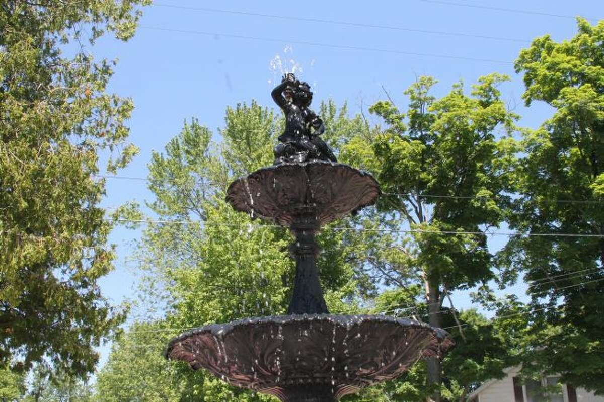 A merman adorns the recently refurbished historic Memorial Fountain in Onekama Village Park. (Scott Fraley/News Advocate)