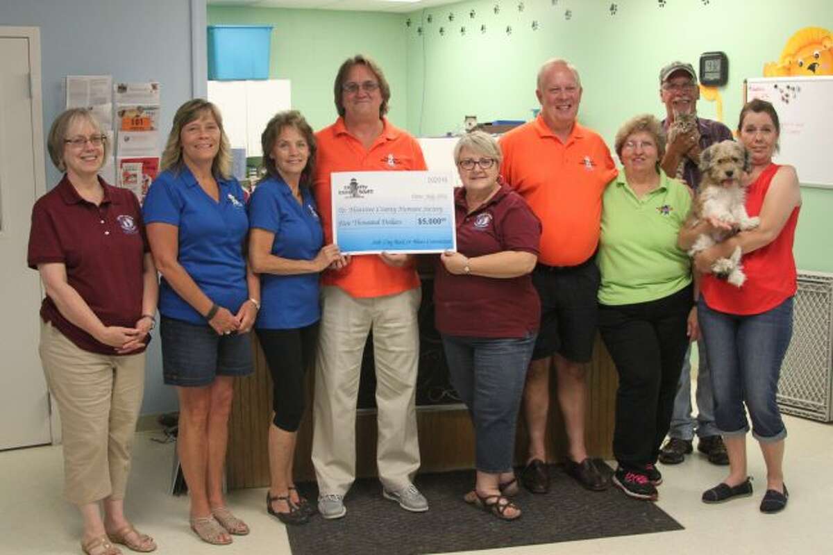 The Salt City Rock and Blues donated $5,000 to Homeward Bound Animal Shelter with proceeds from the concert they hosted over the Manistee National Forest Festival. Shown left to right Homeward Bound’s Mary Ann Wreschnig, Salt City Rock’s Penny Kiss, Susan Flarity, Paul Anderson, Homeward Bound’s Deb Green, Salt City Rock’s Bob Ogilvie, Homeward Bound’s Sharon Monnot, Salt City’s Dave Greve and Homeward Bound’s Shareen Edmondson.