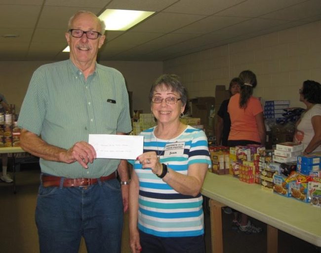 Men Who Care Manistee County donate to food pantry