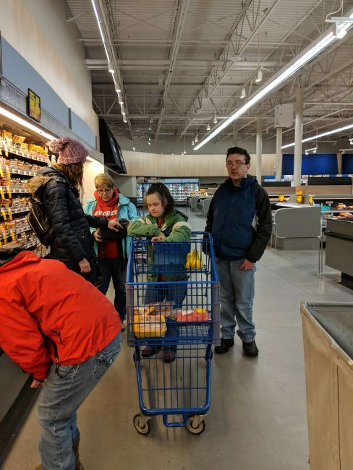 Learning to live on your own means being able to purchase food for yourself and students are shown at the Meijer Store learning how to pick out food items.