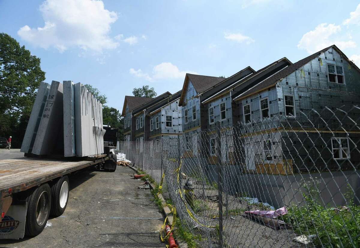 Construction continues on the new apartment additions to the Armstrong Court public housing development in July. The Housing Authority is seeking approvals for more work at Armstrong Court as well as at Quarry Knoll but the selectmen want to look at the overall affordable housing situation in town.