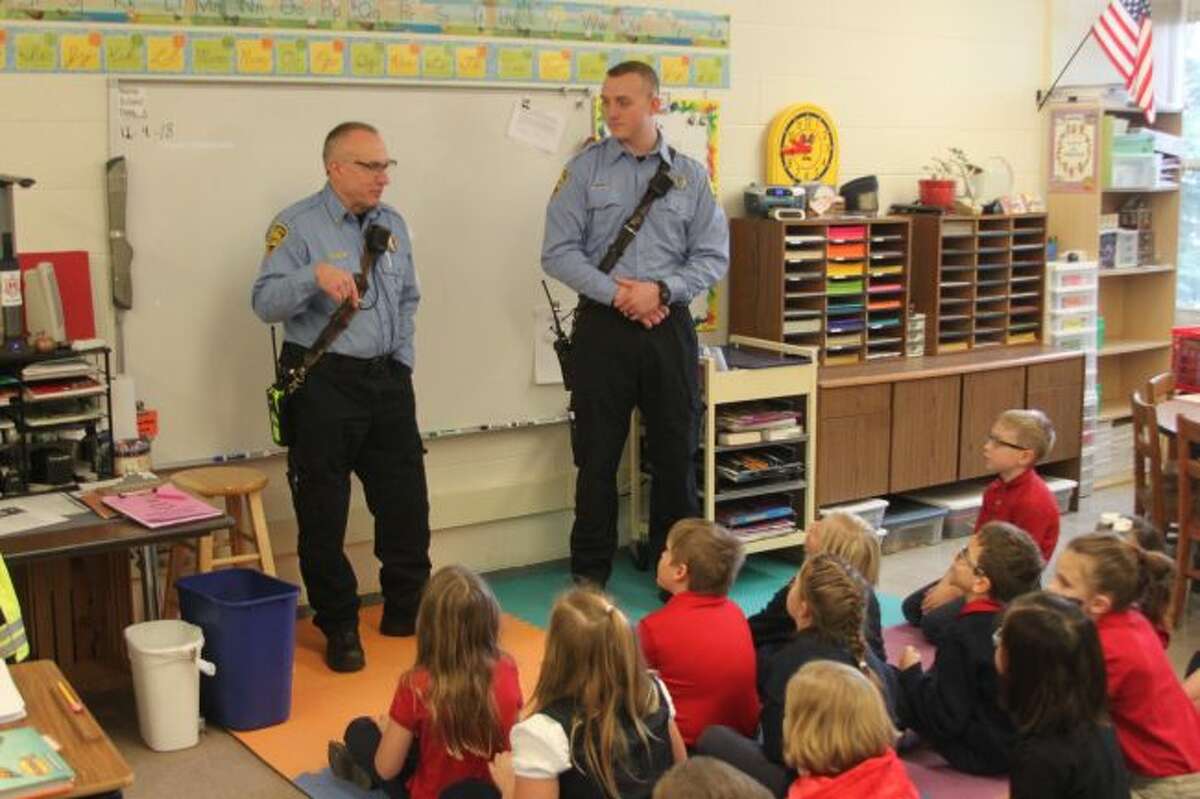 City of Manistee firefighters Doug Dominick and Dan Reck talk to the third grade class at Manistee Catholic Central about fire safety. Students in the kindergarten to sixth grade level get two visits a year by the local fire department to teach the students about how to be safe from fire at home.