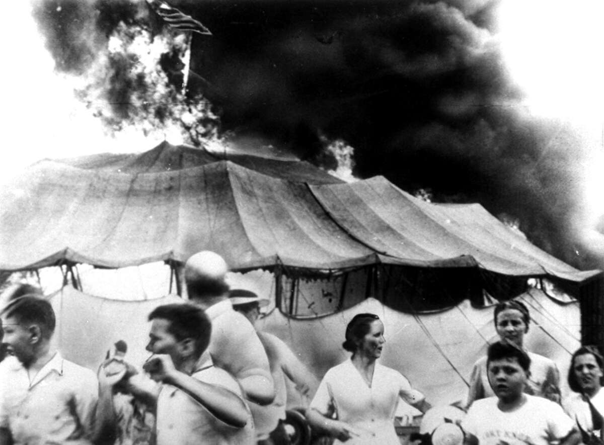 Circus spectators run for safety as a fire beaks out in a tent, July 6, 1944, at the Ringling Bros. Barnum and Bailey Circus, in Hartford. By the time the tent collapsed, 167 people were dead and more than 700 injured in the disaster that became known as “The Day the Clowns Cried.”